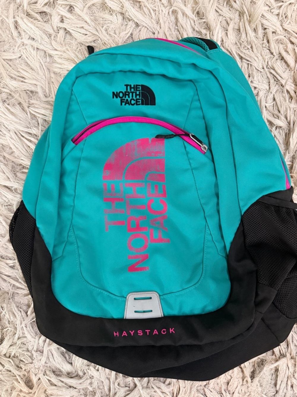 The North Face Teal Backpack with Pink Logo and Black Base